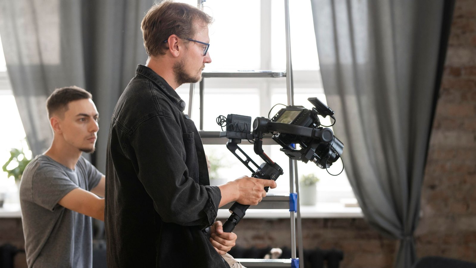 what does an executive producer do​, 2 men shooting a video