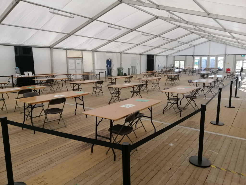 Hardstanding area on the studio lot with tables set out under a marquee