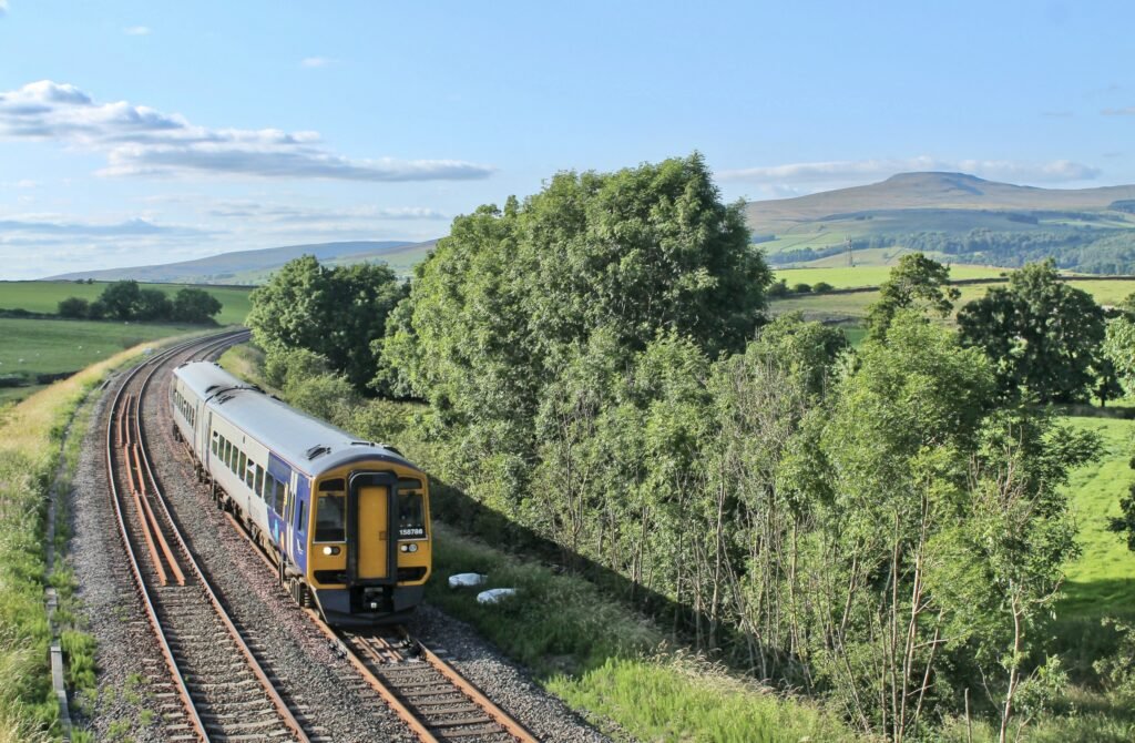 A train travelling through the Hampshire countryside