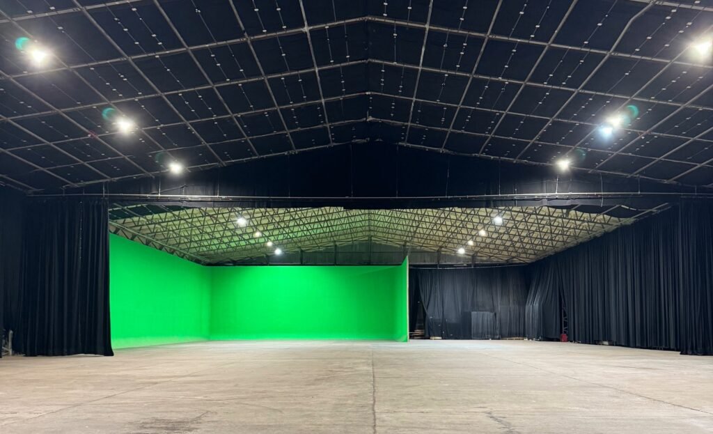 Black Hangar sound stage with the green screen cyclorama and lighting rig