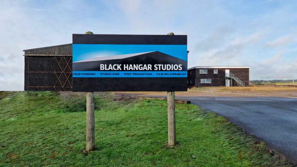 Black Hangar Studios sign at the studio entrance